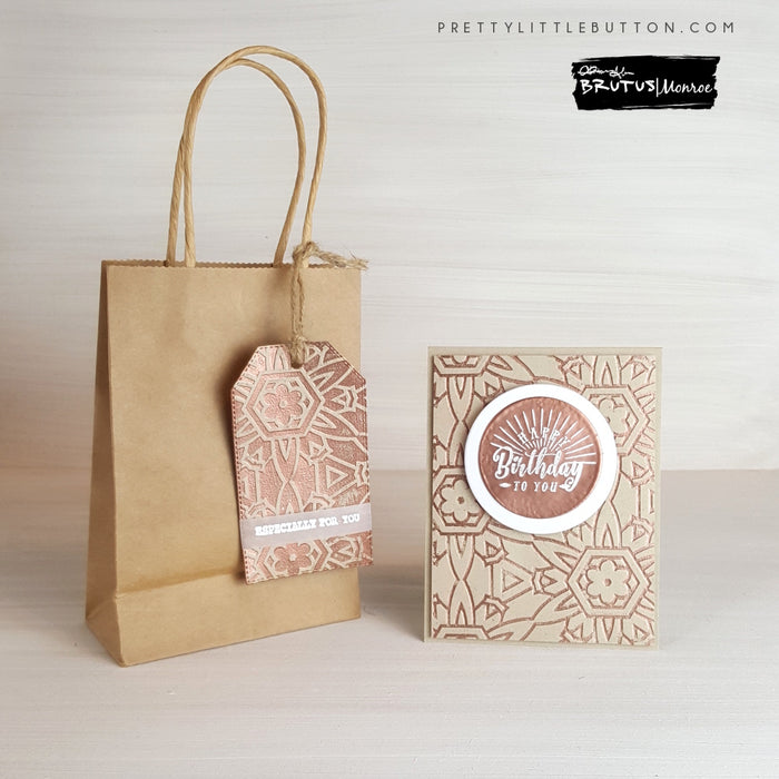 Unisex multi-embossed card and tag