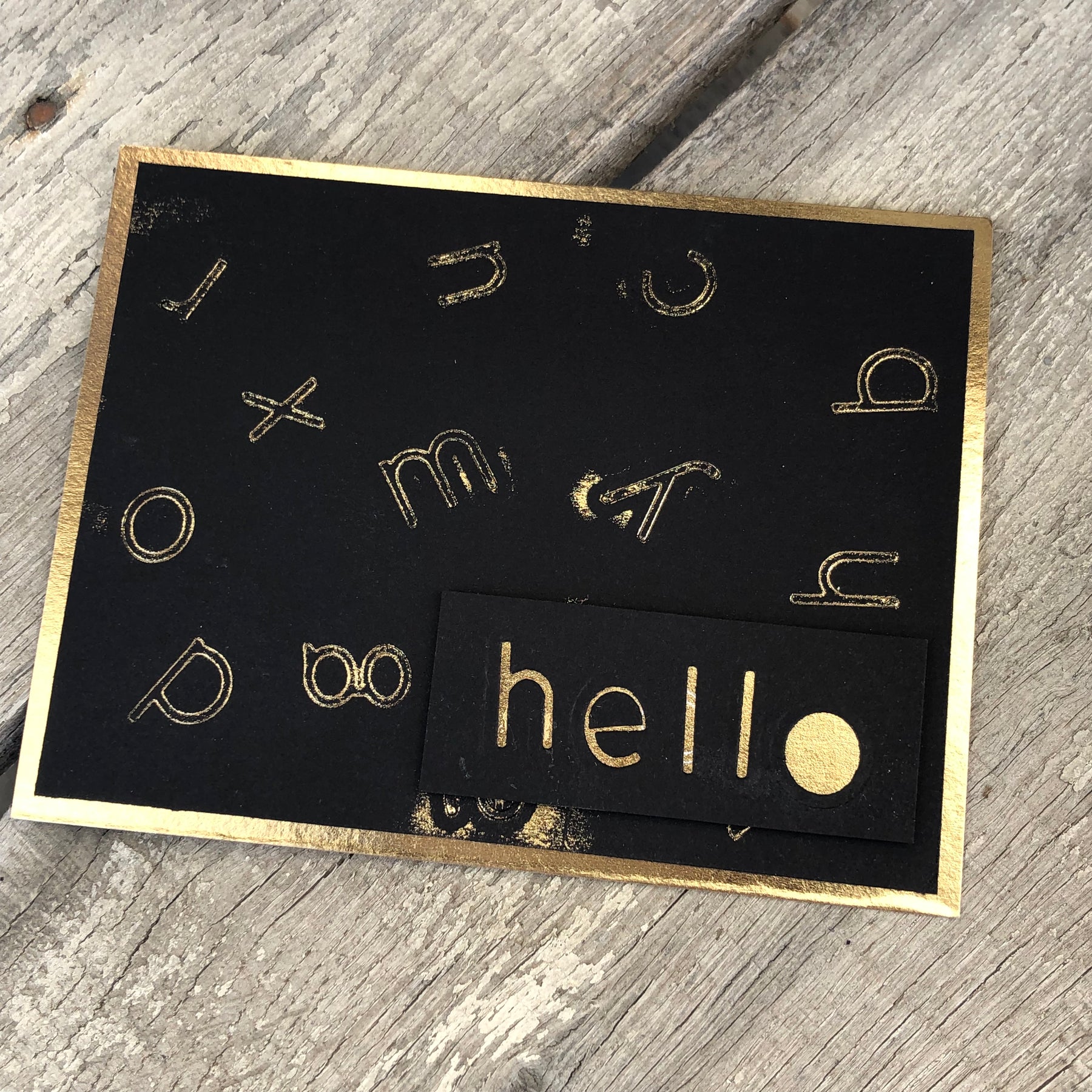 Foiled card with alphabet dies.