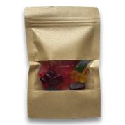 Kraft paper snack bag with colorful gummy bears inside on a white background
