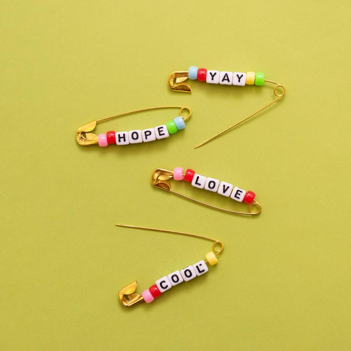 Jen Hadfield | Reaching Out Metal Safety Pins | W/Phrase Beads